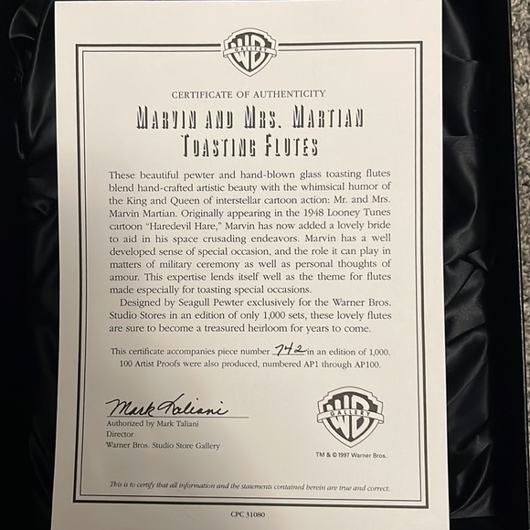 Mr and Mrs Marvin toasting glasses. 742/1000 - Picture 2 of 3